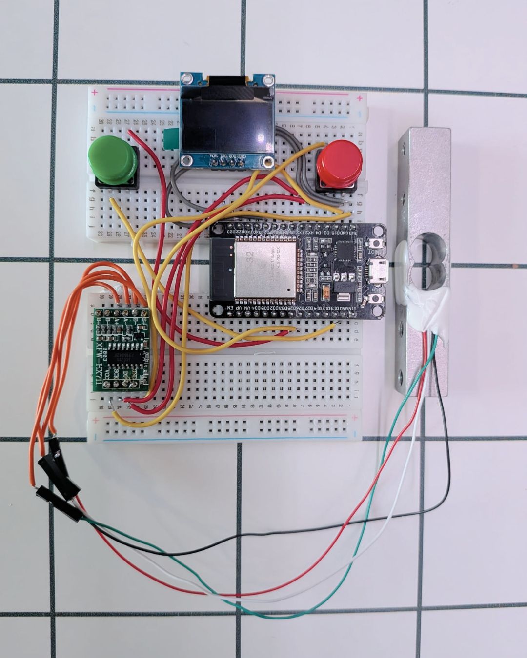 Breadboard wiring of the HX711, SSD1306 OLED and push button to an ESP32 DevKit