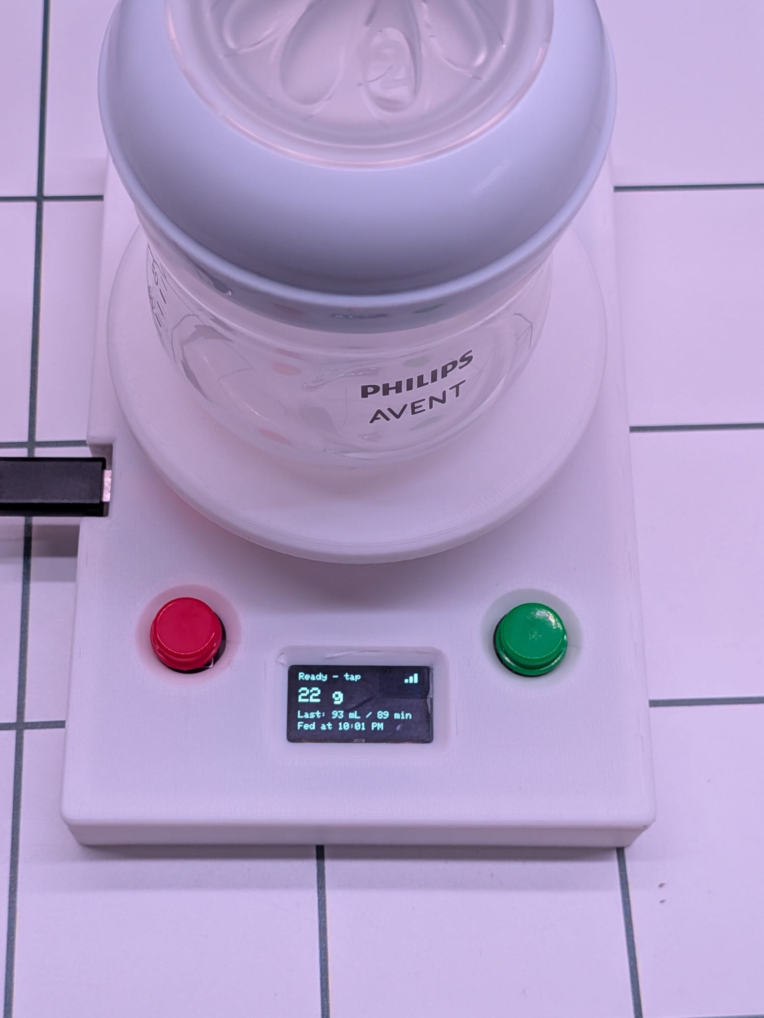 The finished feed logger with its round weighing platform mounted, ready to use